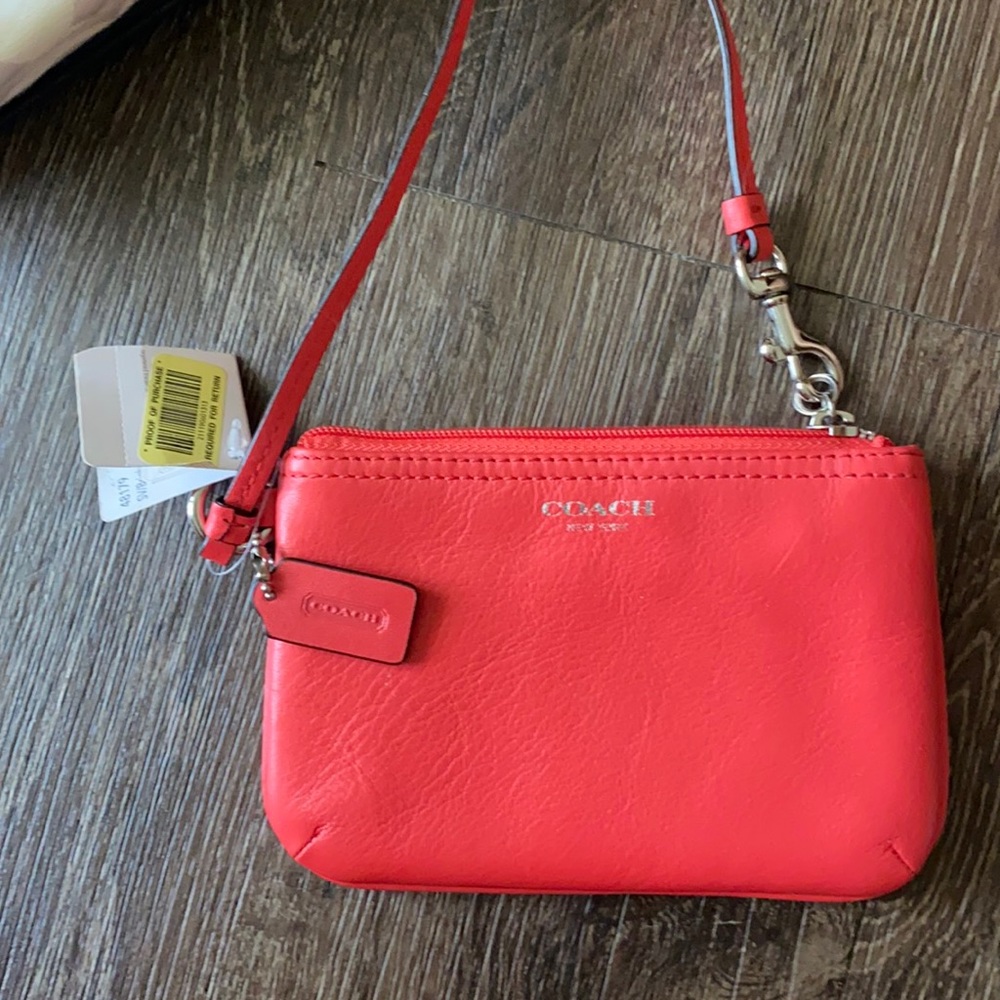 Coach wristlet leather coral color